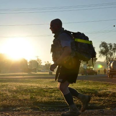 Photo: Master Sgt. Eric Rees, Headquarters and Headquarters Company, 159th Combat Aviation Brigade, presses on during a 6-mile ruck march Oct. 3 at Fort Campbell, Kentucky. This event conditions Soldiers for the Army’s standard 12-mile trek in full gear.