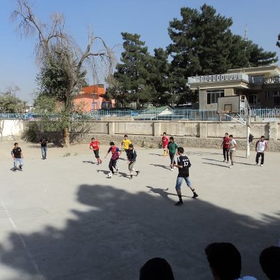 Photo: On October 1, five soccer players from the new Afghanistan Premier League visited a high school in Kabul City.  The players talked to the students about the importance of saying no to drugs, and the eighty students in attendance were thrilled to play a pick-up game with these star Afghan athletes.