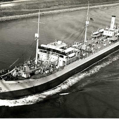 Photo: USS Salinas a United States Navy oiler was laid down for the United States Shipping Board on 10 April 1919 by the Newport News Shipbuilding and Dry Dock Co., Newport News, Va. and was launched on May 5, 1920. She commenced carrying fuel from naval fuel depots and Caribbean and Texas oil ports to Navy bases and stations on the east and west coasts, in the Caribbean, in the Panama Canal Zone, and, in the late 1920s, to Marine Corps units in Nicaragua. In October, 1941 the Salinas was hit by two torpedoes from a German U-Boat off the coast of Newfoundland, Canada and survived (this was before America was officially at War). Throughout most of World War II the Salinas would transport much needed oil supplies between Canada and South America.  She was decommissioned on January 16, 1946. Her name was struck from the Navy list on 26 February 1946. This photograph shows the U.S.S. Salinas as she moves thru the Cape Cod Canal on her way to deliver to our Canadian allies in 1941. RG 077, Records of the U.S. Army Corps of Engineers, Photographs of the Cape Cod Canal.