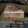 Date: 12/05/2011 Description: Swastikas scrawled on tombstones is an example of anti-Semitism.  © Albanian Jewish Solidarity Association