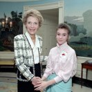Photo: What young actress is posing with Mrs. Reagan?