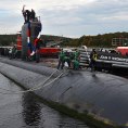 Photo: 121012-N-TN558-057

121012-N-TN558-057 
GROTON, Conn. (Oct. 12, 2012) Sailors assigned to the Los Angeles-class attack submarine USS Toledo (SSN 769), heave around the first mooring line as their boat is held in position by two supporting tugboats. Toledo returned from a seven-month deployment in the 6th fleet area of operations. The U.S. Navy has a 237-year heritage of defending freedom and projecting and protecting U.S. interests around the globe. Join the conversation on social media using #warfighting. (U.S. Navy photo by Mass Communication Specialist 1st Class Jason J. Perry/Released)