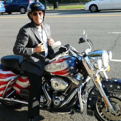 Photo: Yesterday this mystery man stopped by for a photo shoot inside the National Archives in the morning. In the afternoon, he came back, but this time he was riding a motorcycle with "We The People" on it. Can you guess who this is? 

Hint: You've heard his voice on public radio! Wait...wait....don't...