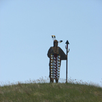 A metal sentinel of a Mandan, Hidatsa, or Arikara Indian guiding visitors to the Earth Lodge Village of the Three Affiliated Tribes of New Town, North Dakota