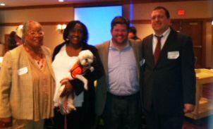 Photo: Rev. Angela Lundy, Founder/CEO of Interfaith Speciality Services; Rosalind McKelvey, Interpreter and Director & Founder of Germantown Deaf Ministries Fellowship (holding Rev. Lundy's assist dog, Iris); Neil McDevitt, Senior Instructor at Leadership Foundry & a deaf firefighter; and Chad Thomas, Communications Outreach Coordinator at the Philadelphia Department of Public  Health, pose for a picture at the Second Annual Functional Needs Symposium.