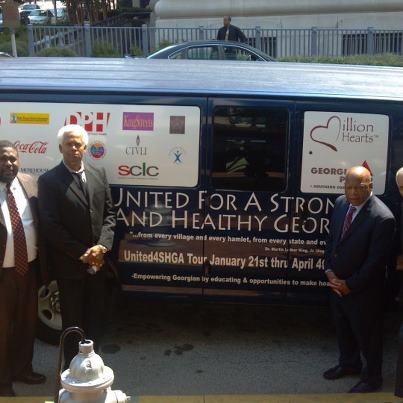 Photo: Congressman John Lewis and SCLC President CT Vivian standing near an Office of the Assistant Secretary for Health van  traveling throughout the twelve Regions of GA spreading information about the Million Hearts campaign.