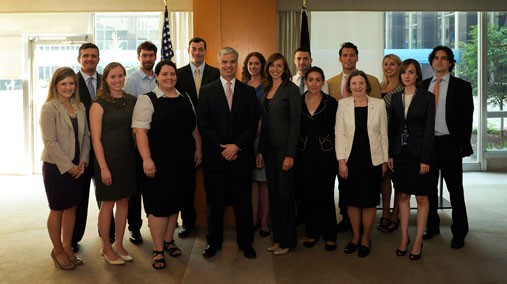 Deputy Assistant Secretary of State for Political-Military Affairs (PM) Walter Givhan poses for a photo with members of the Frasure, Kruzel, and Drew families, as well as past and current fellowship recipients of the Frasure-Kruzel-Drew Memorial Fellowship for Humanitarian Demining at the U.S. Department of State in Washington, D.C., August 29, 2012. [State Department photo/ Public Domain]