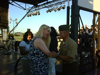 Samantha Eddleman receives congratulations from Col. Lecce after becoming a US citizen on July 4 at Camp Lejeune, North Carolina