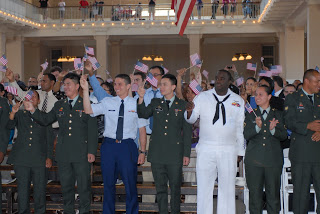After the swearing-in, applause and waving flags