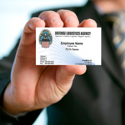 Man's hand holding a DLA Business Card
