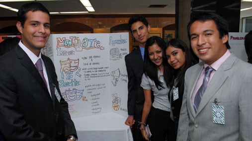 Participants of the Jóvenes en Acción program proudly present their service project at the U.S. Department of State in Washington, D.C. [State Department photo/ Public Domain]