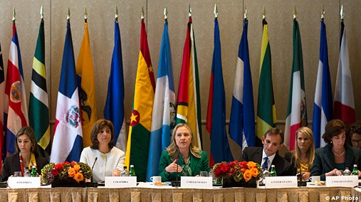 Secretary of State Hillary Rodham Clinton, alongside Columbian Foreign Minister Maria Angela Holguin Cuellarmeets, center left, addresses the Connecting the Americas meeting on the margins of the United Nations General Assembly, Sept. 27, 2012 in New York. [AP Photo]