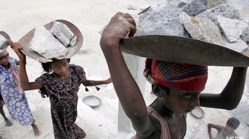 Child laborers carry stones, Gauhati, India, June 11, 2008. [AP File Photo]