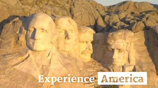 Mt Rushmore National Memorial, as seen in a screenshot of a Consular Affairs video inviting travelers to the United States. [State Department image/ Public Domain]