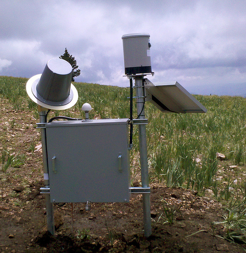 Buck Mountain precipitation gage with solar panel, radio stand, and electronics—Whitewater Baldy Complex Fire, N.M.