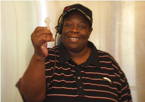 Samantha Hills and her children spent the last five years living with relatives. Using funds provided through American Recovery and Reinvestment Act she now owns her own home. Here, she holds the key to her house. August 24, 2010. (by John Audibert, USDA Rural Development) 