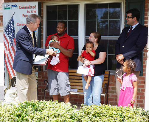 Pennsylvania Rural Development  State Director Tom Williams (far left) and Acting Administrator for Rural Business Services John Padalino (far right), celebrated National Homeownership Month with Rural Development Housing Loan Recipient Willie Hall and his family at their new  home in Chambersburg.