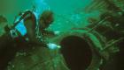 A diver examines the wreck of U-85.