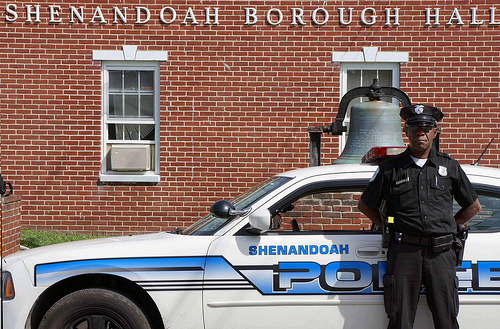 Shenandoah Patrolman Kirk Kirkland stands in front of his police cruiser in front of Borough Hall. An $18,240 Rural Development Community Facilities Economic Impact Initiative grant will help the Borough purchase a new four-wheel drive police cruiser to better serve the rural residents of Shenandoah.