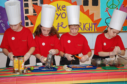 Intent on their work, Charter Oak student chefs carefully assemble their competition entry Fiesta Wrap.