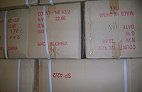 Transshipment moves goods through another country. Transshipment becomes an illegal activity when it is used to circumvent quotas or duties. The thread in this Youm Kwang facility in Central America was shipped from China and dyed at the facility. The labels and export documentation claimed that the thread was “100% made in Guatemala.” The Jump Team discovered boxed thread with “made in China” printed on the containers, and the Guatemala facility had no capacity to manufacture the yarn.  