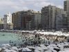Egyptians crowd a public beach during a hot day in the Mediterranean port city of Alexandria