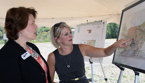 U.S. Department of Agriculture (USDA) Rural Development (RD) Business and Cooperative Programs Administrator Judith Canales (left) and President of the Board of Directors Kim Barker discuss the plans for the new $1.6 million in Community Facility loan funding for the Riverhouse Children’s Center in Durango, CO on Thursday, Aug. 30, 2012. USDA photo by Amy Mund.