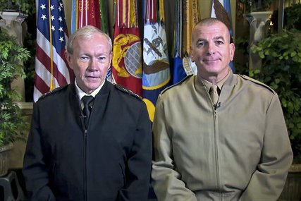 Army Gen. Martin E. Dempsey, chairman of the Joint Chiefs of Staff, and his senior enlisted advisor, Marine Corps Sgt. Maj. Bryan B. Battaglia, record a video message encouraging service members to exercise their right to vote. 