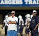   Chargers General Manager A.J. Smith (left) and head coach Norv Turner watch their team during football practice at the Chargers training camp. 
