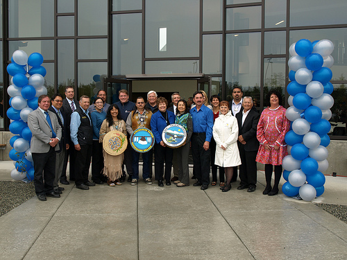 USDA Rural Development Alaska State Director Jim Nordlund (4th from right rear) joins tribal dignitaries and government officials at the grand opening of Southcentral Foundation’s Valley Native Primary Care Center