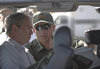 A Border Patrol agent explains the use of sighting mechanism to the President.