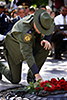 CBP Border Patrol agent lays a rose for a fellow fallen agent at Law Enforcement Memorial held in Washington DC.