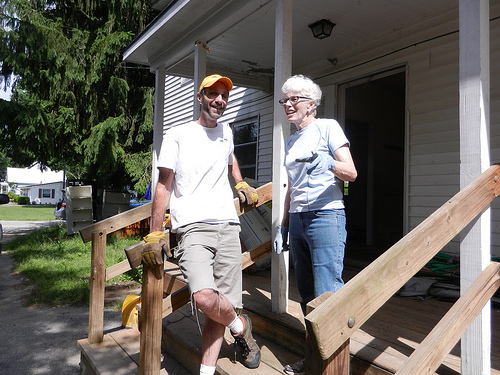 Robert McDonald, Housing Program Director and Molly Lambert, State Director USDA Rural Development on front steps of Mountainside House Teen Center in Ludlow VT.  USDA staff helped repair the building as part of June Homeownership Month activities. 