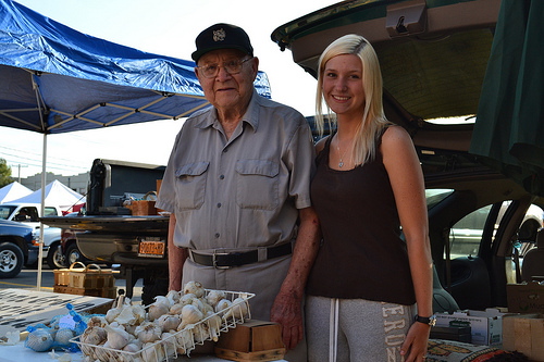 Elmer Moje with his granddaughter. Moje used to help his father bring their crops to the Tonawanda farmers market. Photo by Sharif Hamdy