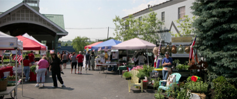 Vendors and customers on the 2012 opening day of the Jeffersontown Farmers Market.  It took collaboration, innovation and community support to transform this ailing market into a vibrant town centerpiece.