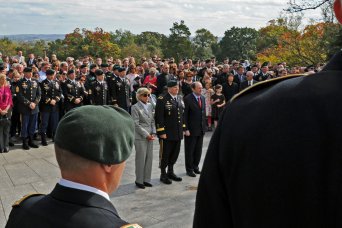 Brig. Gen. Christopher K. Haas, commander of Army Special Forces Command (Airborne) escorts Jean Kennedy Smith and Michael A. Sheehan, assistant secretary of Defense for Special Operations and Low-Intensity Conflict to the John F. Kennedy grave at Arlington National Cemetery Oct. 18. They placed a wreath honoring JFK for his vision in building a dedicated counter-insurgency and unconventional warfare force that the commander in chief designated as Green Berets.