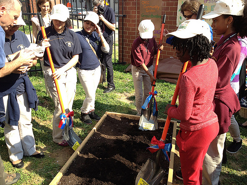 Students from Columbia Heights Educational Campus participate in the symbolic first dig in their new garden.  The People’s Garden will grow food for both the school and people in need. 