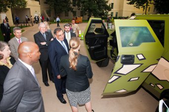 U.S. Army Research, Development and Engineering Command employees explain the Fuel Efficient Ground Vehicle Demonstrator Bravo's benefits to Secretary of Defense Leon Panetta (center) at the Pentagon, Oct. 4, 2012.
