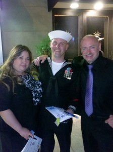 Photo of Navy sailor Andrew Turner and wife meeting astronaut Mark Kelly