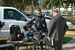 A CBP officer in Miami talks to a job fair participant about the equipment used in the field.