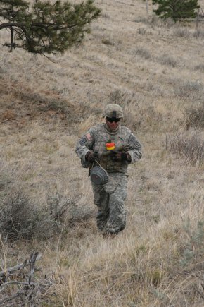 Sgt. Dominic Giannini, 663rd Ordnance Company, 242nd Explosive Ordnance Disposal Battalion, 71st Ordnance Group (EOD), collects ordnance during a training exercise Oct. 9, 2012, at Camp Guernsey, Wyo.