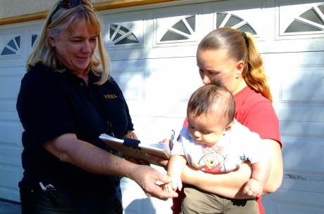 Mitigation specialist Barb Ellis meets with a Napa county flood victim. Photo by Adam DuBrowa
