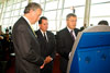 Jos Nijhuis, Chief Executive Officer, Schiphol Group BV; CBP Acting Commissioner Jayson P. Ahern and Dutch Minister of Justice Ernst Hirsch Ballin at JFK in New York use a Global Entry kisok. 