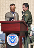 Border Patrol Chief David Aguilar Presents an 85th anniversary commemorative badge set to Homeland Security Assistant Secretary Allen Bersin. 