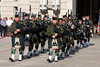 Customs and Border Protection Pipe and Drum corps play at the beginning of the Wreath Laying Ceremony held at the Ronald Reagan building in Washington, D.C.