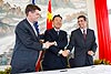 ICE Assistant Secretary John Morton, Chinese Embassy Deputy Chief of Mission Xie Feng and CBP Assistant Commissioner of International Affairs Al Gina join hands at a signing ceremony at the Chinese Embassy in Washington, D.C. celebrating the repatriation of fossils to the People's Republic of China. 