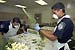 CBP Agriculture Specialists examine flowers for hitchiking pests that could cause potential damage to crops in the U.S.