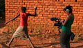  Young woman being recorded throwing ball (Global Lives Project) 