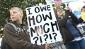 A boy holds a protest sign (AP Images) 