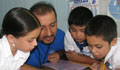 Intel volunteer reading with children (Courtesy of Intel)  